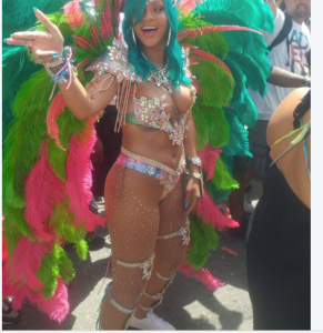 Rihanna smolders in sexy, beaded bikini and feathers at Crop Over Festival in Barbados