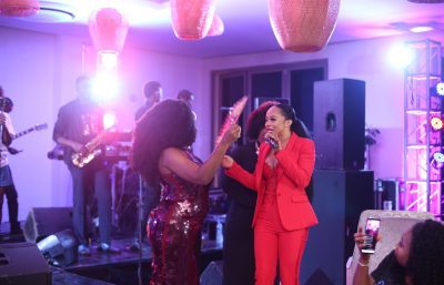 Toke Storms Omawumi’s Exclusive Listening Party in Hot Red Attire